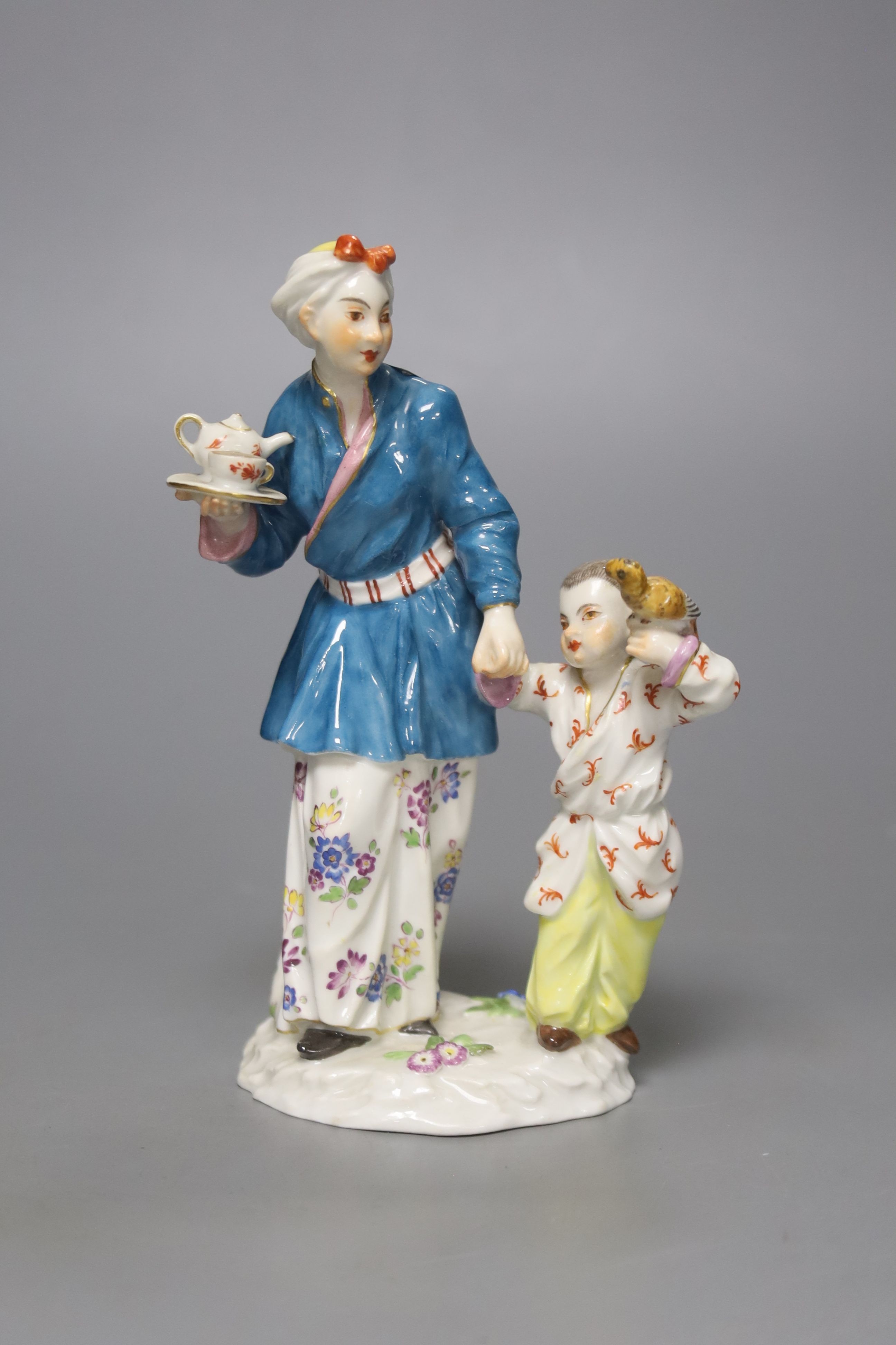 A Meissen group of a Chinese lady and a boy, 20th century, height 14cm